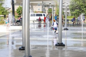 Kids enjoying the splash pad at the Johnston Town C